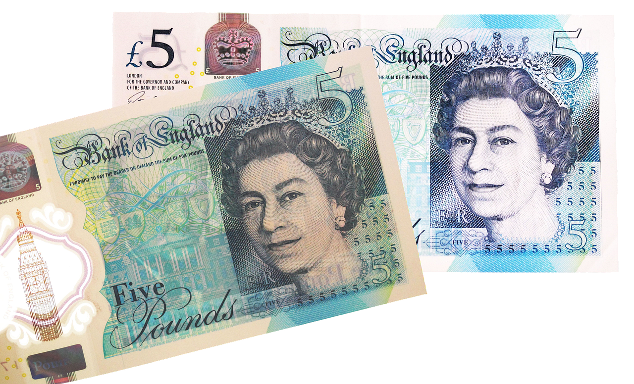 Two five pounds notes - UK currency.